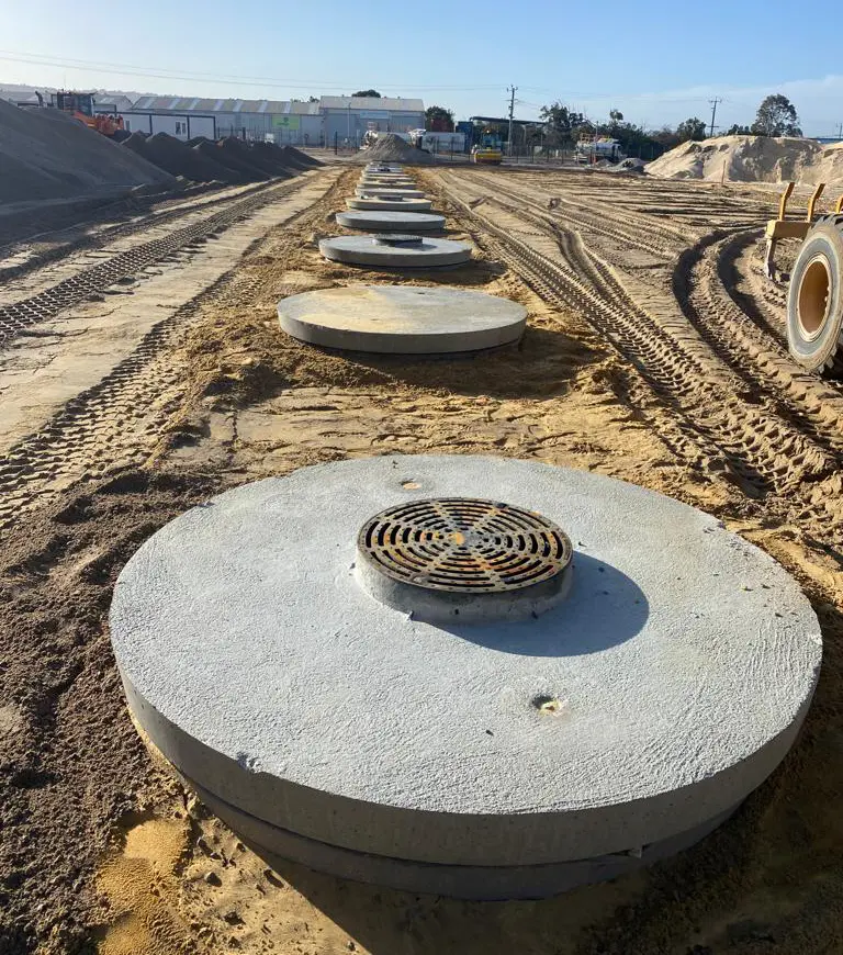 EKWA Contractors’ earthmoving and heavy machinery in action during a roadwork project in Western Australia, including bulldozers, excavators, and loaders.