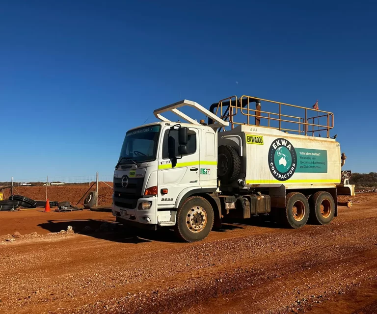 EKWA Contractors Hino service truck and water truck parked on-site, showcasing premium plant hire options and high-quality truck rentals available across Western Australia.